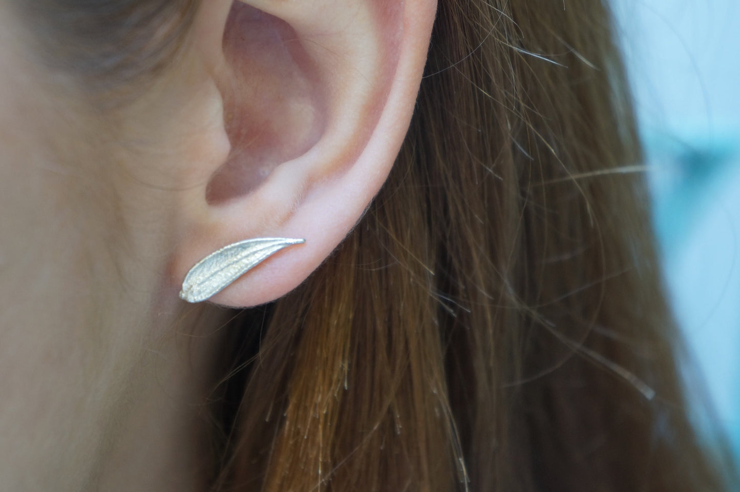 Minimal leaf stud earrings in sterling silver by Mother Nature.