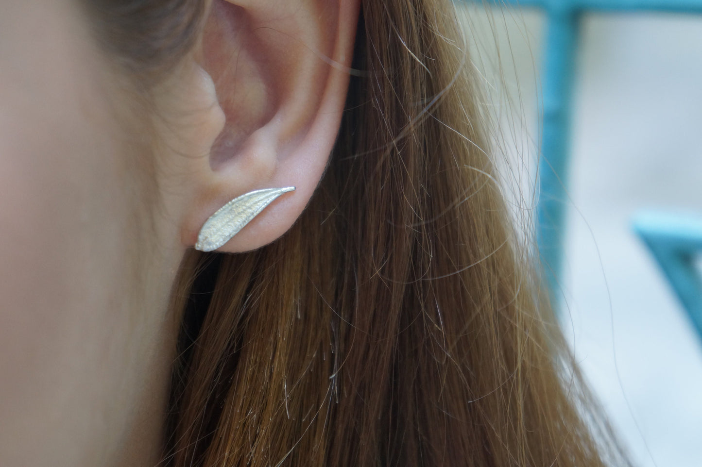 Minimal leaf stud earrings in sterling silver by Mother Nature.