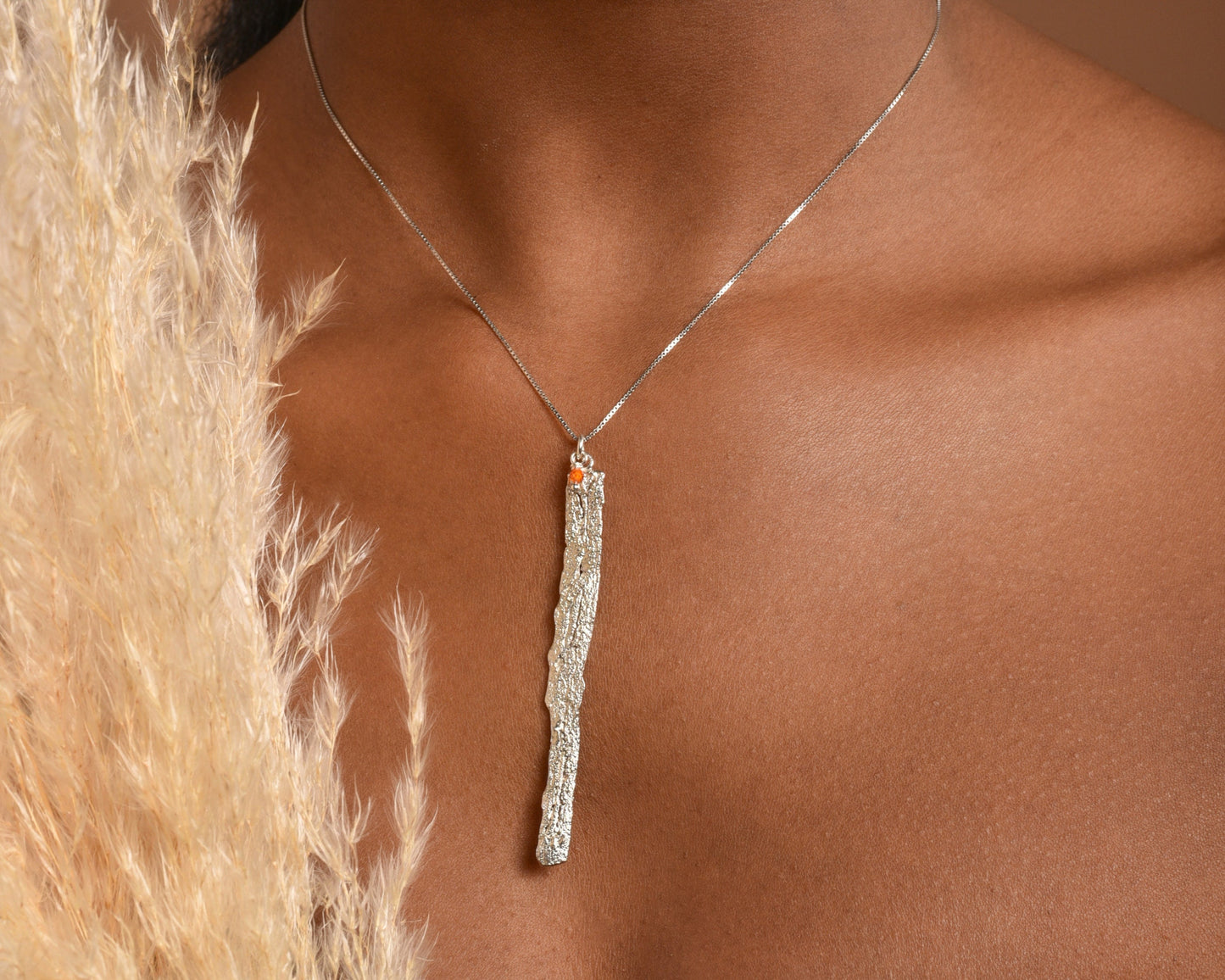 Pendant made of citrus tree bark. It comes on chain with a tiny crystal hanging or on elegant wire rope. Created by Mother Nature for you!