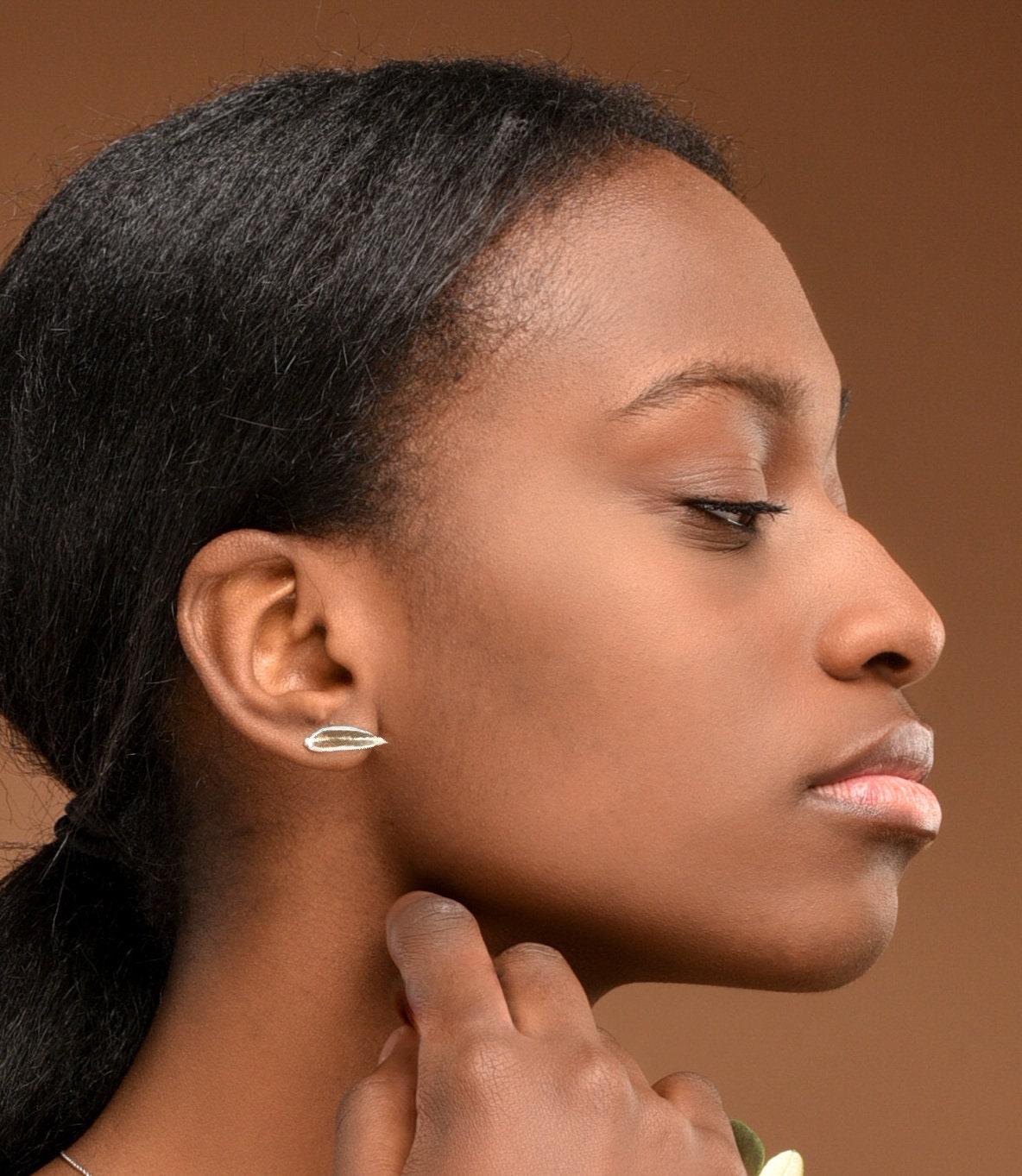 Minimal leaf stud earrings in sterling silver by Mother Nature.