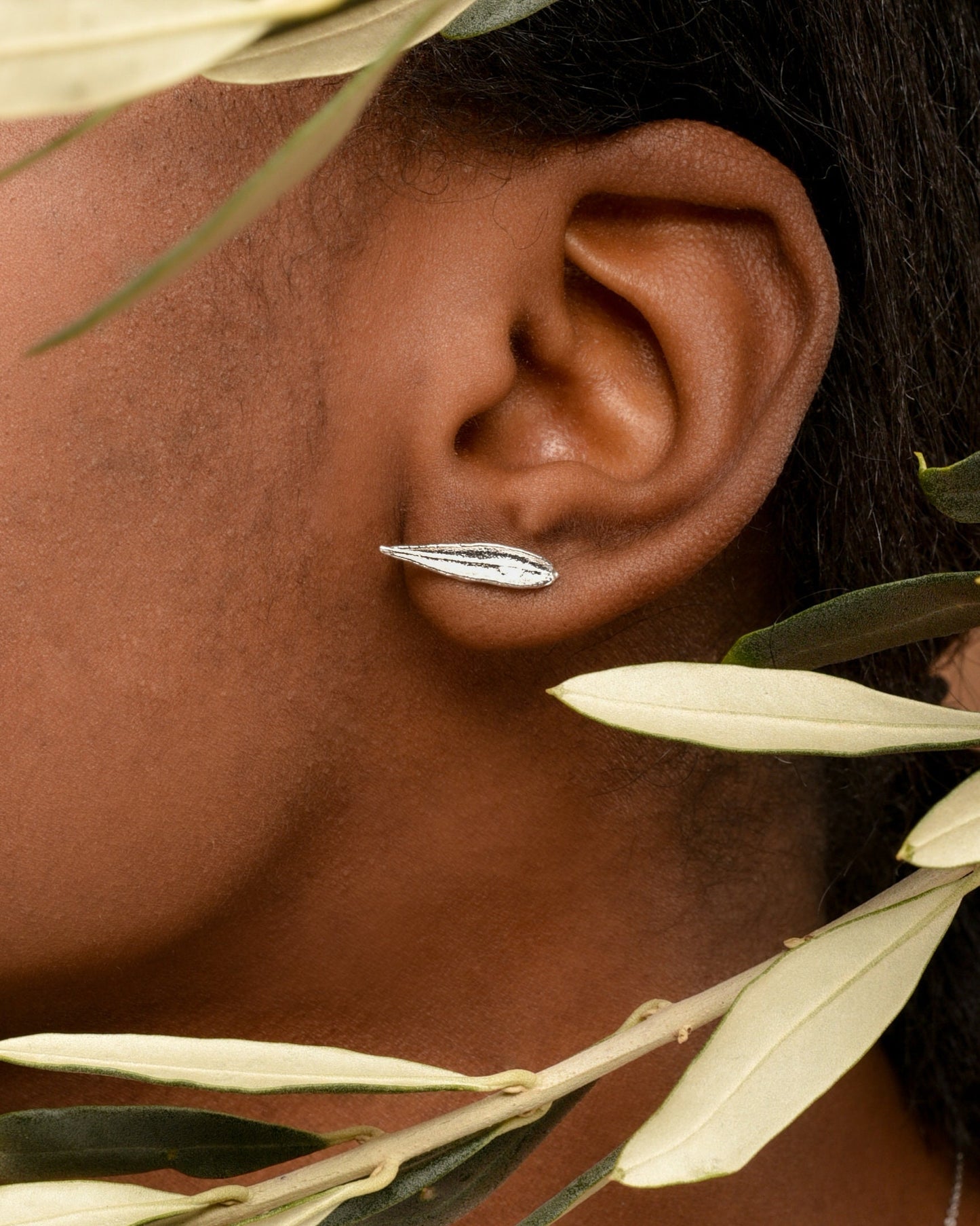 Minimal leaf stud earrings in sterling silver by Mother Nature.