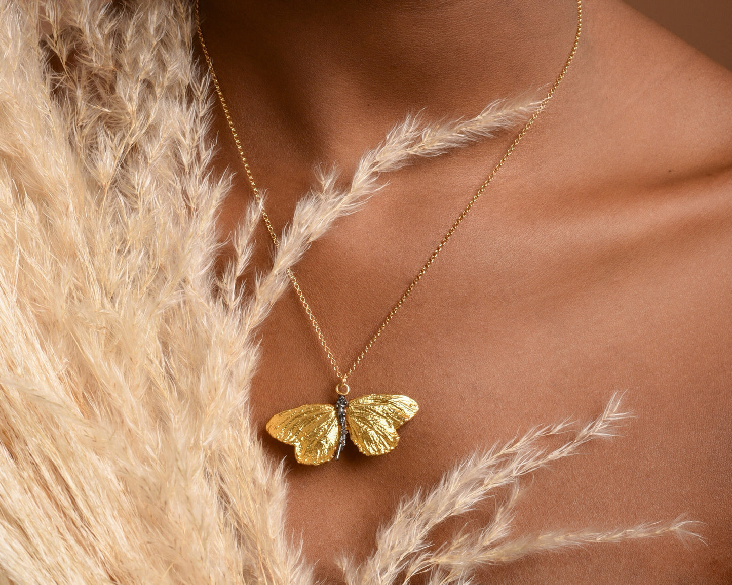 18k Gold plated butterfly necklace on sterling silver by Mother Nature Jewelry. Symbol of powerful transformation.