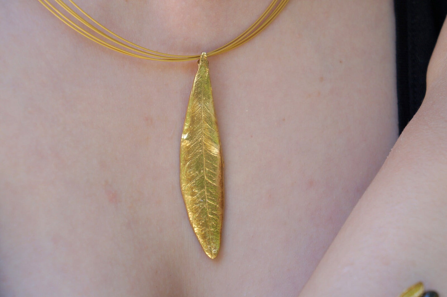 Solid gold Olive leaf Pendant 9ct,14ct,18ct by Mother Nature Jewelry. The olive branch is a symbol of peace , protection and fertility.