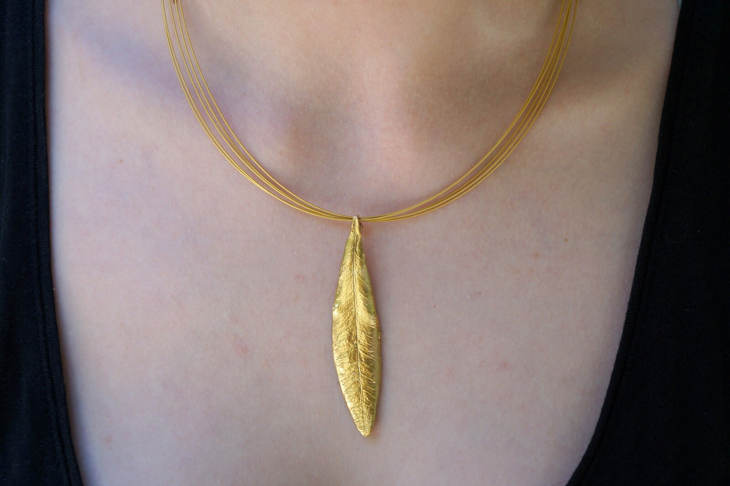 Solid gold Olive leaf Pendant 9ct,14ct,18ct by Mother Nature Jewelry. The olive branch is a symbol of peace , protection and fertility.