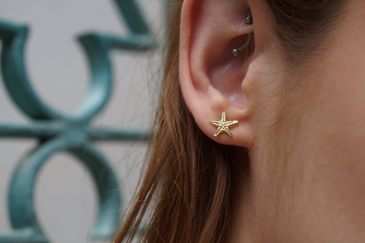 Solid gold stud earrings starfish. Star Fish symbolizes the 5 elements. Earth, Air, Water, Fire, Spirit.